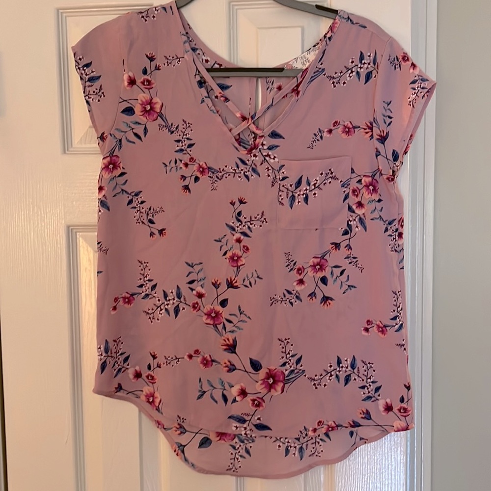 Short sleeve Nylon top with flowers. Cross in front.